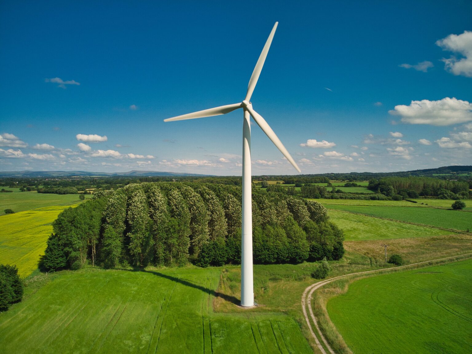 Rural wind farm turbine aerial view of rural wind turbine